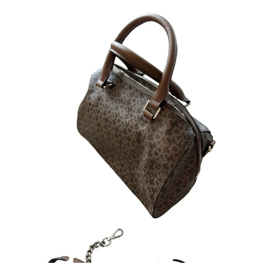 DKNY brown monogram bag is a DKNY Bryant Boston tote featuring an all-over logo